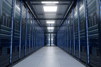 Modern data centre with rows of server racks in a climate-controlled server room.