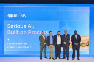 Five men standing on stage at the Appian APJ event in Sydney, in front of a screen displaying “Serious AI. Built on Process.”