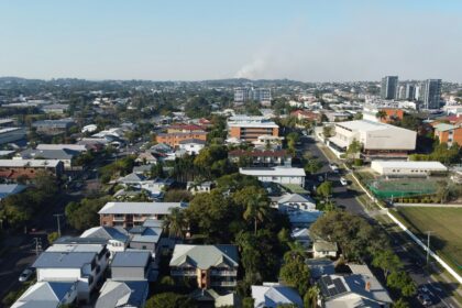 Aerial view of a city with lots of houses in suburbia.
