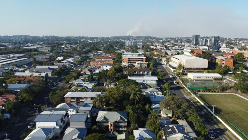 Aerial view of a city with lots of houses in suburbia.